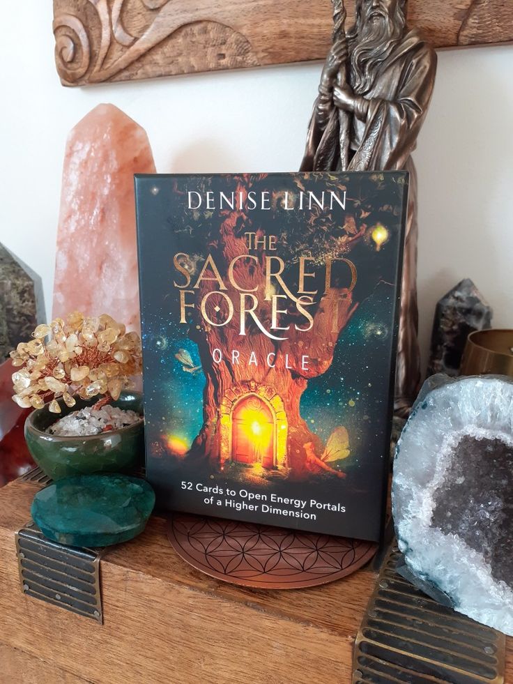 The Sacred Forest Oracle deck placed on a wooden altar with crystals and spiritual decor, symbolizing intuitive guidance, Akashic Records readings, and deep spiritual insights with Align With Rosie.